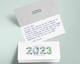 Neujahrskarten in Handschrift von Robotern - FlowerPower 2023